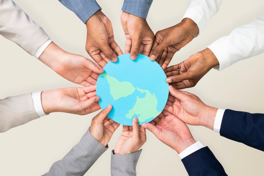 Hands holding paper globe